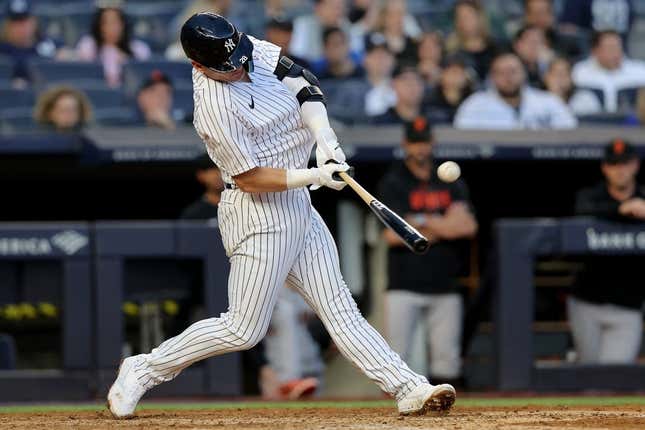 Apr 1, 2023; Bronx, New York, USA; New York Yankees third baseman Josh Donaldson (28) hits a solo home run against the San Francisco Giants during the eighth inning at Yankee Stadium.
