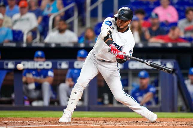 Jun 5, 2023; Miami, Florida, USA; Miami Marlins second baseman Luis Arraez (3) hits a single against the Kansas City Royals during the fourth inning at loanDepot Park.