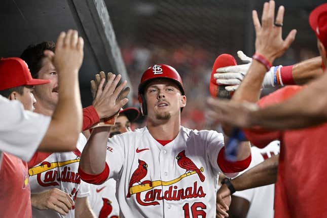 Jul 17, 2023; St. Louis, Missouri, USA;  St. Louis Cardinals pinch hitter Nolan Gorman (16) is congratulated by teammates after scoring against the Miami Marlins during the sixth inning at Busch Stadium.