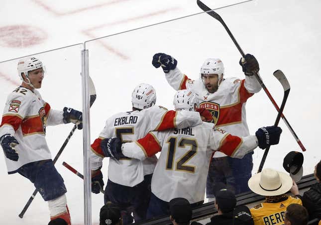 Apr 19, 2023; Boston, Massachusetts, USA; Florida Panthers center Eric Staal (12) is congratulated after his goal by center Colin White (6), defenseman Aaron Ekblad (5) and defenseman Gustav Forsling (42) during the second period of game two of the first round of the 2023 Stanley Cup Playoffs against the Boston Bruins at TD Garden.