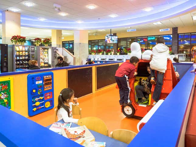 Children romp in the play area during Wednesday pizza night.