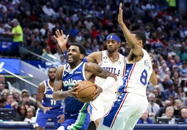 Mar 2, 2023; Dallas, Texas, USA; Dallas Mavericks guard Kyrie Irving (2) drives to the basket past Philadelphia 76ers guard De'Anthony Melton (8) during the second quarter at American Airlines Center.