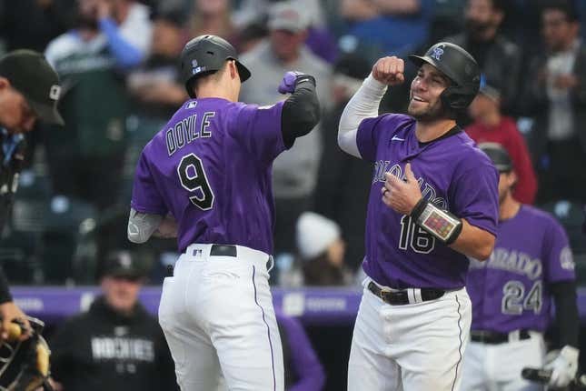 May 15, 2023; Denver, Colorado, USA; Colorado Rockies center fielder Brenton Doyle (9) celebrates his two-run home run with catcher Austin Wynns (16) in the fourth inning against the Cincinnati Reds at Coors Field.