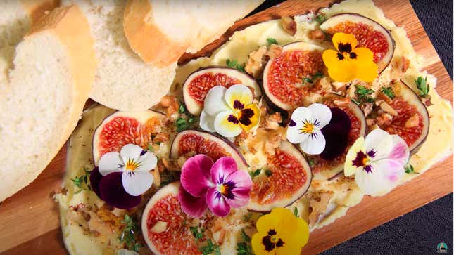 Butter board with figs and edible flowers