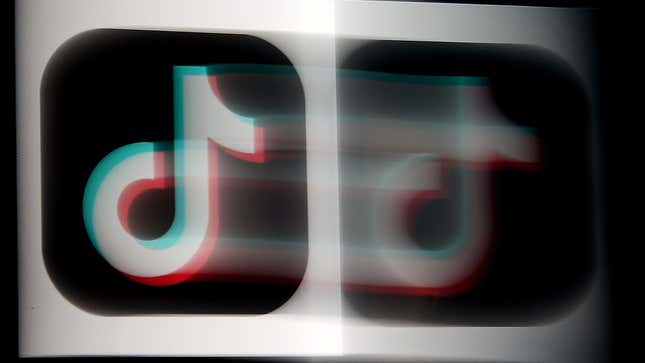 The TikTok logo blurring across the screen from right to left.