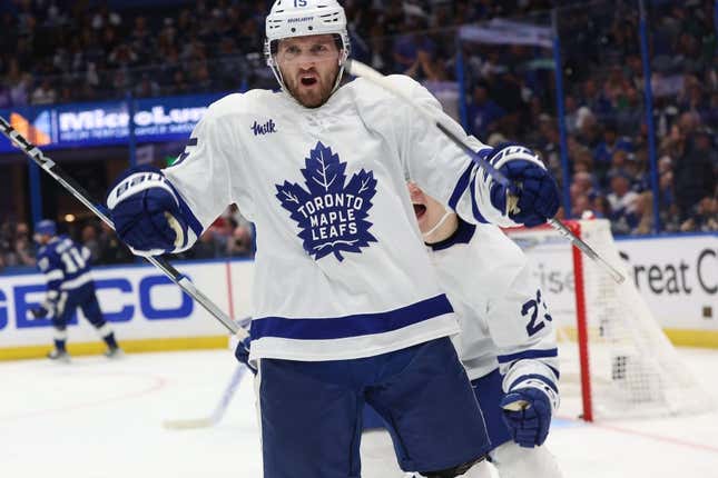 Apr 24, 2023; Tampa, Florida, USA; Toronto Maple Leafs center Alexander Kerfoot (15) celebrates after he scored the game-winning goal against the Tampa Bay Lightning in overtime of game four of the first round of the 2023 Stanley Cup Playoffs at Amalie Arena.