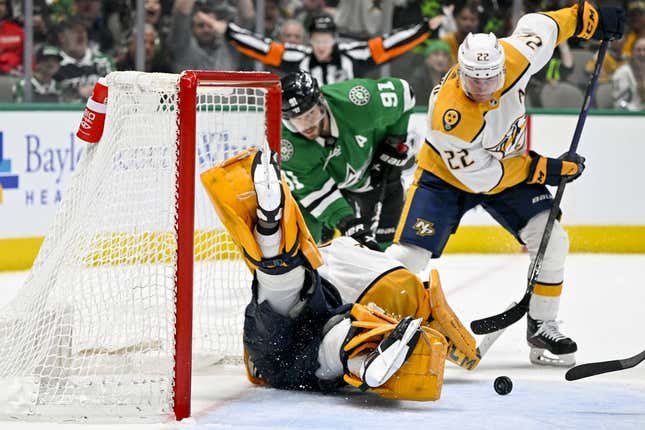 Apr 3, 2023; Dallas, Texas, USA; Nashville Predators goaltender Juuse Saros (74) makes a save as defenseman Tyson Barrie (22) and Dallas Stars center Tyler Seguin (91) look for the rebound during the second period at the American Airlines Center.