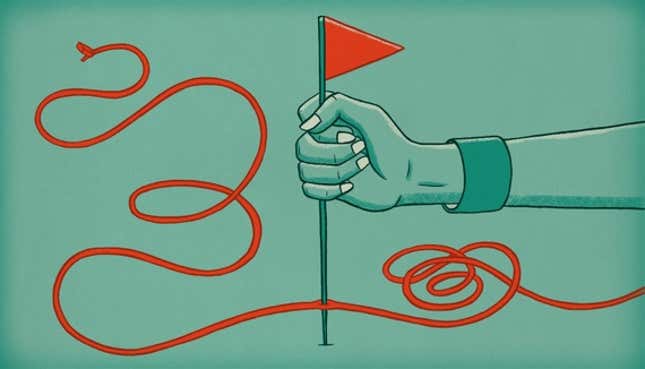 Image of woman pinning down wire with a flag