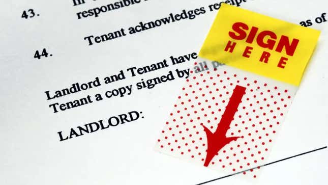 A lease document with a tag reading "sign here" pointing to where the tenant and landlord should sign