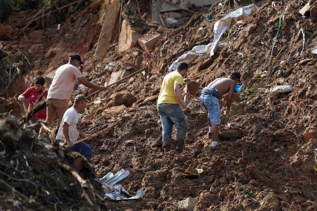 Residents search for survivors on the second day of rescue efforts.