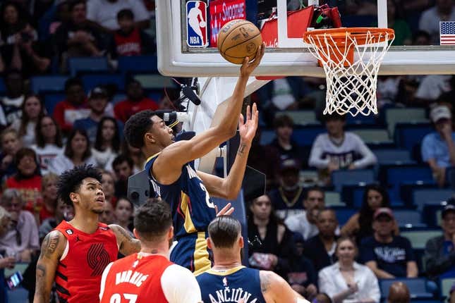 Mar 12, 2023; New Orleans, Louisiana, USA; New Orleans Pelicans guard Trey Murphy III (25) drives to the basket against Portland Trail Blazers center Jusuf Nurkic (27) during the first half at Smoothie King Center.