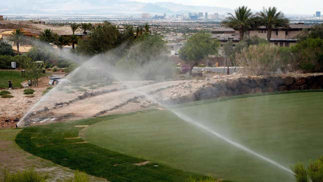 Hotel-casinos on the Las Vegas Strip are seen behind sprinklers watering the golf course at DragonRidge Country Club June 19, 2009 in Henderson, Nevada. According to the Southern Nevada Water Authoity the Colorado River system, Nevada's main source of water, is facing the worst drought on record and Lake Mead's water level has dropped approximately 100 feet since January 2000. 