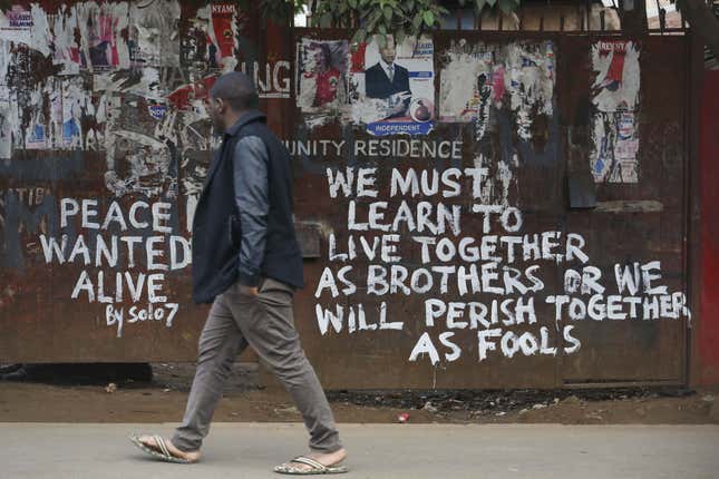 A man walks past a gate with a peace message painted by local street artist Solomon Muyundo, also known as Solo7, in Kibera slum, Nairobi, Kenya, 13 August 2017. After three days of running battles between stone throwing supporters and riot police, Kenyan opposition leader Raila Odinga told the assembled masses, 13 August, that he believed that the election had been stolen from them, that the government was using the police to kill his supporters, and that nobody should go to work. Odinga's Chief Agent James Orengo also told crowds that elements of the media were biased and prejudiced against them. Kenya general elections results aftermath, Nairobi - 13 Aug 2017