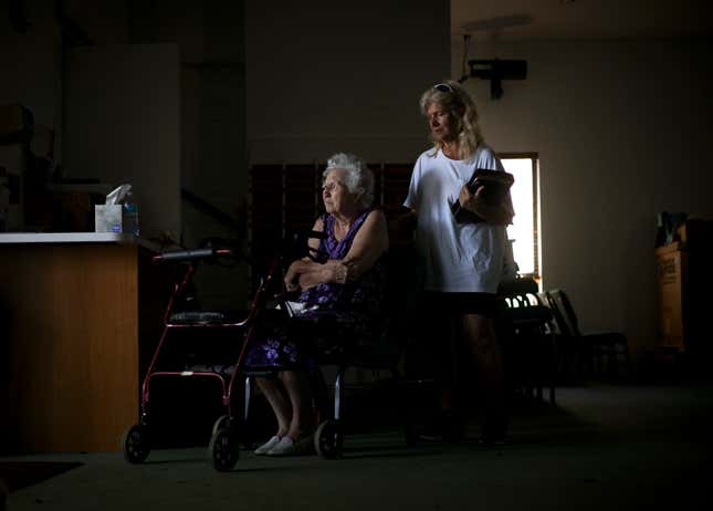 Charlene Flener, pictured seated in a wheelchair, in Southwest Baptist Church on Sunday, October 2; Fiener’s home was damaged during the hurricane and she is staying at the church temporarily.