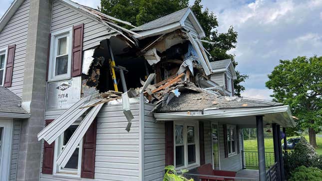 Image for article titled Another Car Has Somehow Ended Up In The Second Story Of A House