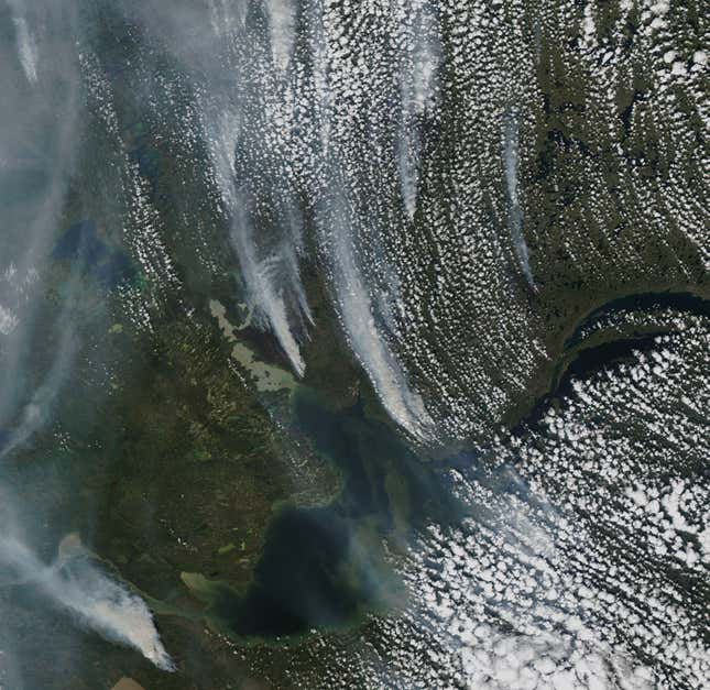 Satellite imagery over Northwest Canada showing lots of smoke and clouds due to wildfires.