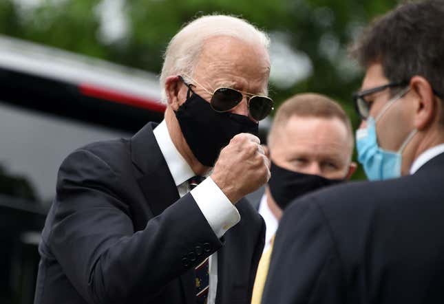 A photo of Joe Biden either in the beginning phases of dapping someone up or about to punch something. Odds are 50-50.