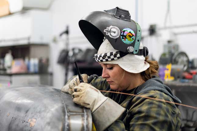 Danae Buschkoetter in her element, welding on the vintage Volvo’s bodywork.