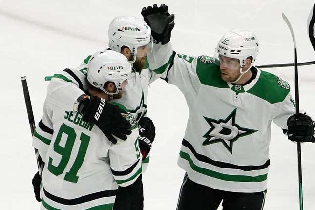 Mar 28, 2023; Chicago, Illinois, USA; Dallas Stars center Tyler Seguin (91) celebrates his goal against the Chicago Blackhawks with teammates during the first period at United Center.