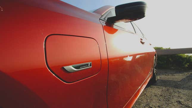 A close up photo of the BMW Electrified logo at the front of the 330e Sedan.