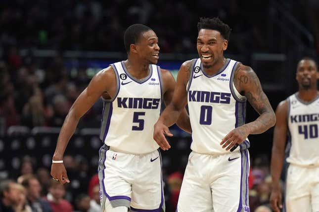 Feb 24, 2023; Los Angeles, California, USA; Sacramento Kings guard De&#39;Aaron Fox (5) and guard Malik Monk (0) celebrate against the LA Clippers in the second half at Crypto.com Arena. The Kings defeated the Clippers 176-175 in double overtime.