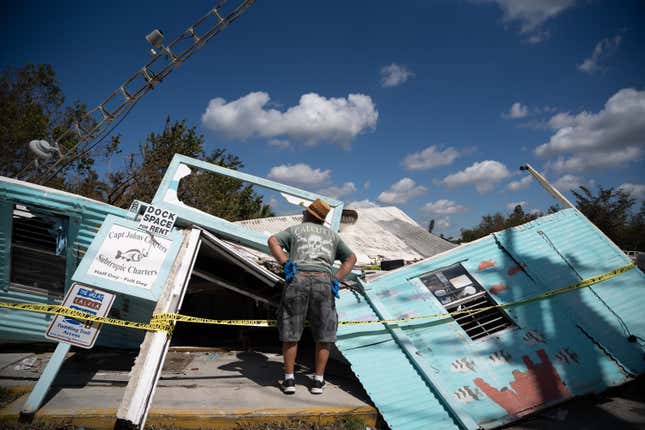 A man looks at his destroyed business in Bonita Springs, Florida, on Saturday, October 1.