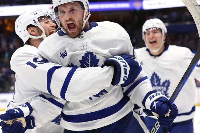 Apr 24, 2023; Tampa, Florida, USA;Toronto Maple Leafs center Alexander Kerfoot (15) celebrates after he scored the game-winning goal against the Tampa Bay Lightning in overtime of game four of the first round of the 2023 Stanley Cup Playoffs at Amalie Arena.