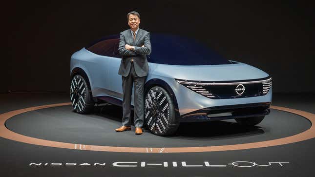 Nissan CEO Makoto Uchida poses in front of the Chill-Out concept.