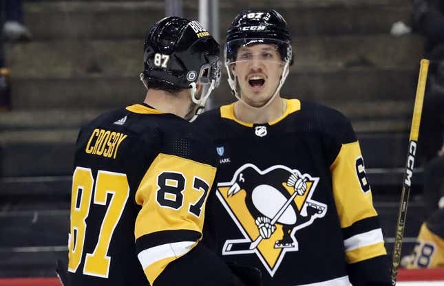 Apr 1, 2023; Pittsburgh, Pennsylvania, USA; Pittsburgh Penguins center Sidney Crosby (87) and right wing Rickard Rakell (67) talk before a face-off against the Boston Bruins during the third period at PPG Paints Arena. Boston won 4-3.