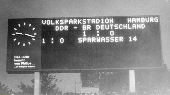 A dot matrix scoreboard displaying the match's final score