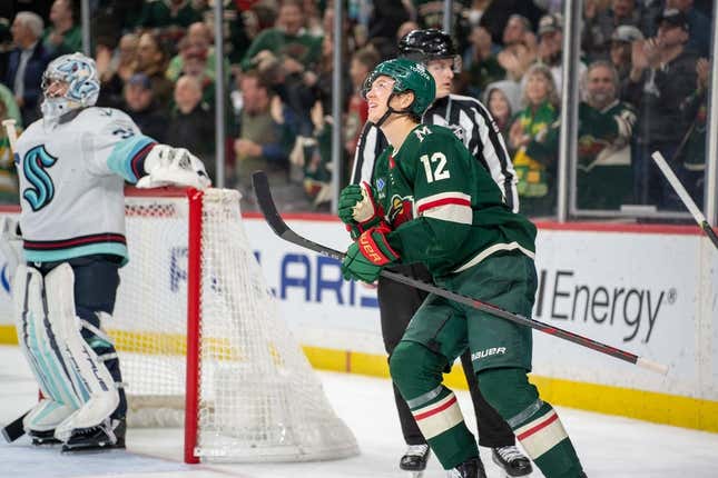 Mar 27, 2023; Saint Paul, Minnesota, USA; Minnesota Wild left wing Matt Boldy (12) looks at the replay of his second goal of the game against the Seattle Kraken in the second period at Xcel Energy Center.