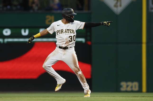 May 22, 2023; Pittsburgh, Pennsylvania, USA;  Pittsburgh Pirates shortstop Tucupita Marcano (30) reacts as he circles the bases on a grand slam home run against the Texas Rangers during the seventh inning at PNC Park.