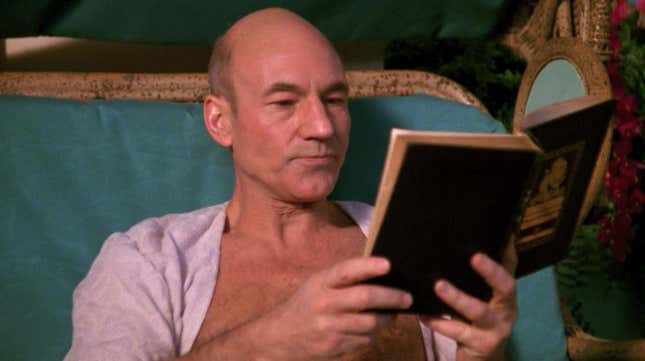 Jean-Luc Picard reads a book in an open robe.