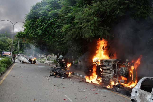 Vehicles set alight by Dera Sacha Sauda sect members in the streets of Panchkula on Aug. 25, 2017.