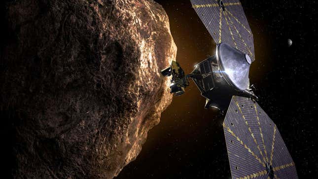 An artist’s depiction of Lucy pasing one of the Trojan asteroids, with Jupiter in the background.