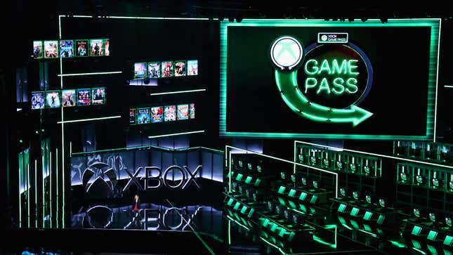Xbox's large stage at E3 2018, complete with copious green lighting and a Game Pass logo.