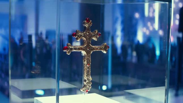 The Saint Dismas Cross hangs suspended in a glass case in the Uncharted movie.