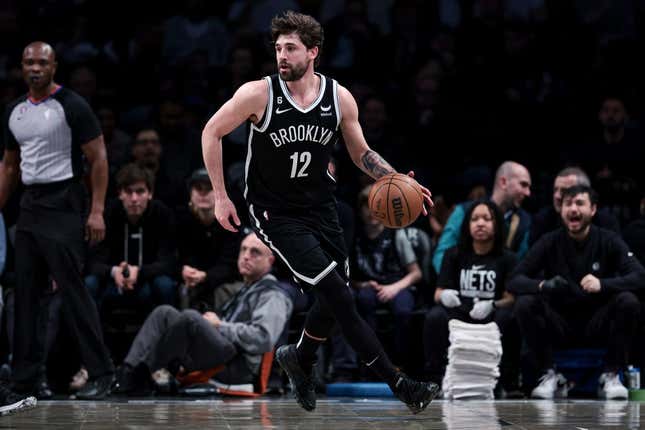 Mar 21, 2023; Brooklyn, New York, USA; Brooklyn Nets forward Joe Harris (12) dribbles during the first half against the Cleveland Cavaliers at Barclays Center.