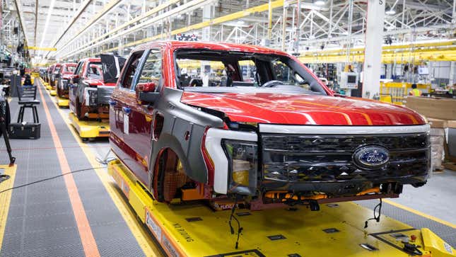 Ford F-150 Lightning pickup trucks roll through the assembly line at the Ford Rouge Electric Vehicle Center in Dearborn, Michigan.