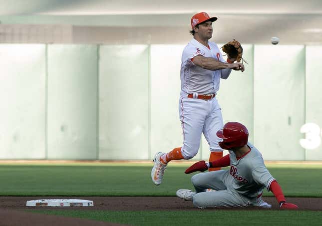 May 16, 2023; San Francisco, California, USA; San Francisco Giants shortstop Casey Schmitt (6) throws over Philadelphia Phillies shortstop Trea Turner (7) to complete a double play during the first inning at Oracle Park. Bryce Harper was out at first.