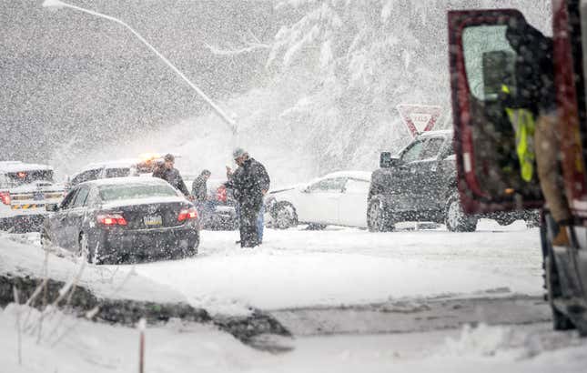 Pennsylvania State Troopers handle a car accident caused by winter weather on March 7, 2018 along the Pennsylvania Turnpike in Philadelphia, Pennsylvania.