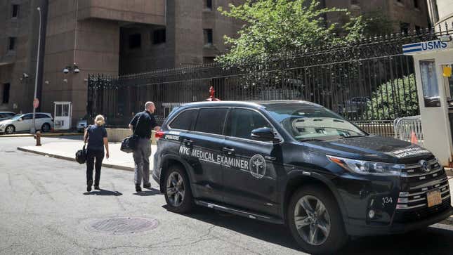 New York City medical examiner personnel walk to the Manhattan Correctional Center where financier Jeffrey Epstein died by suicide while awaiting trial on sex-trafficking charges, Saturday Aug. 10, 2019, in New York