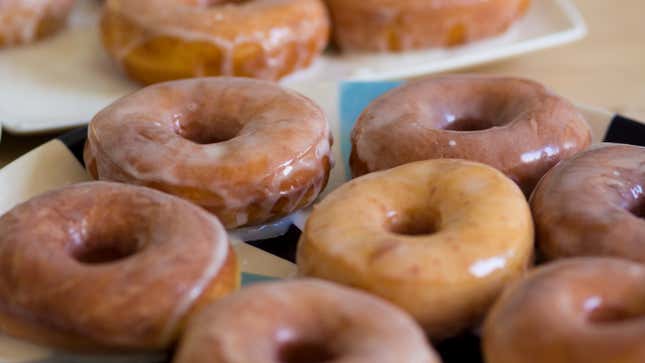 Row of freshly glazed donuts