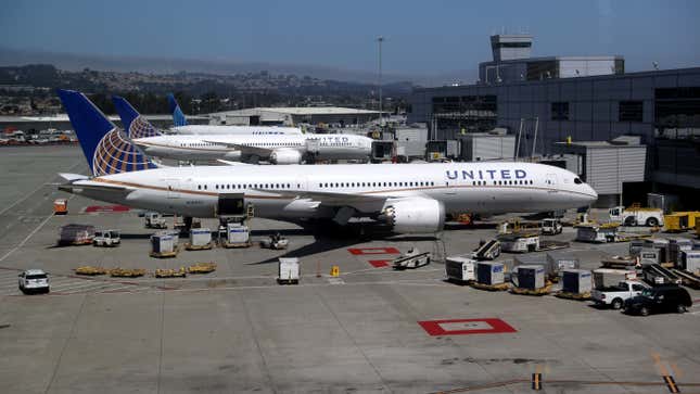 United Airlines planes sit parked at San Francisco International Airport on July 08, 2020 in San Francisco, California. As the coronavirus COVID-19 pandemic continues, United Airlines has sent layoff warnings to 36,000 of its front line employees to give them a 60-day notice that furloughs or pay cuts could occur after October 1.