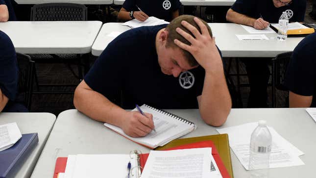 Image for article titled Cadet Studying For Police Academy Exam Just Skimming Over Deescalation Training He’ll Never Use In Real Life