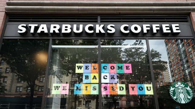  A Starbucks location in New York City displays a welcoming sign in the window in May 2020.