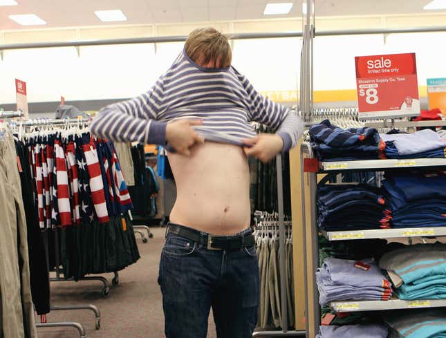 Image for article titled Guy Just Trying On Shirt Right In Middle Of Store