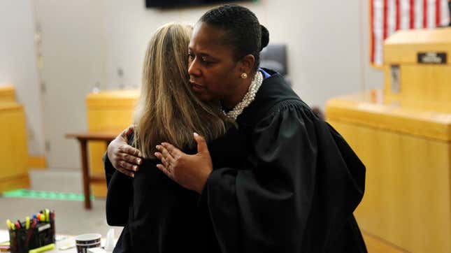 State District Judge Tammy Kemp gives former Dallas Police Officer Amber Guyger a hug before Guyger leaves for jail Oct. 2, 2019, to start a 10-year sentence for murdering an unarmed black man, Botham Jean, in his Dallas apartment.
