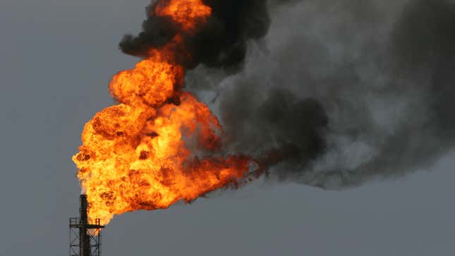 Flames rise in a burn-off of toxic gases at an oil refinery near Los Angeles.
