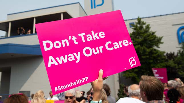 Pro-choice supporters hold up signs at a rally outside the Planned Parenthood Reproductive Health Services Center in St. Louis, Missouri held last May.